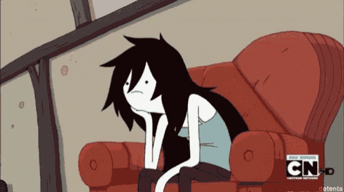 a cartoon character is sitting on a red couch with cn written on the bottom