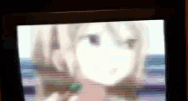 a blurry picture of a girl with a green lollipop in her hand