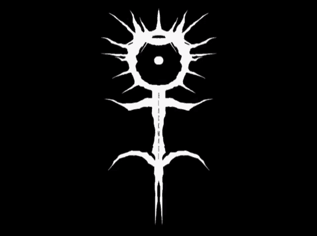 a white symbol on a black background that looks like a flower with a crown on top of it .