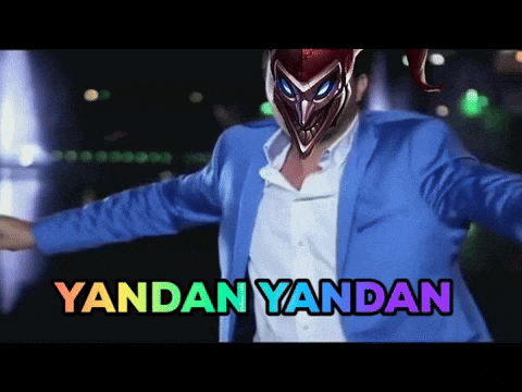 a man in a blue suit has a mask on his head and the words yandan yandan written on the bottom