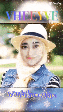 a woman wearing a hijab and a hat with the words " vheeye " on the top