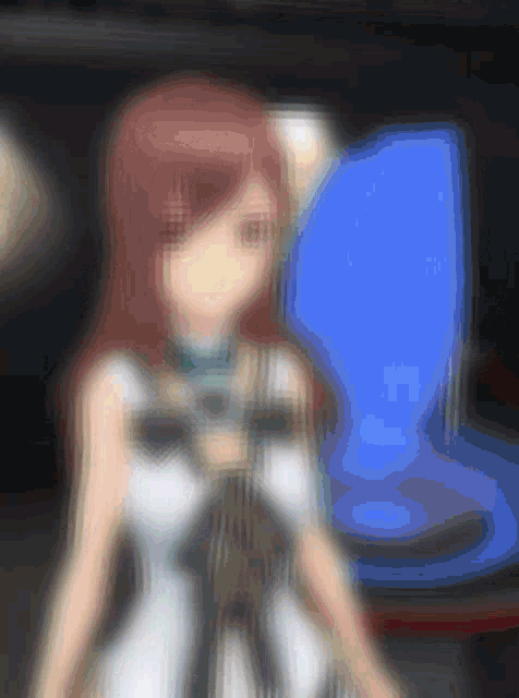 a blurry picture of a girl with red hair in front of a blue screen