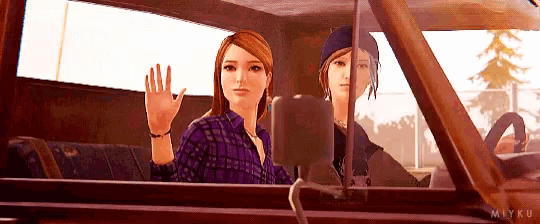 a couple of women are sitting in a car and waving .