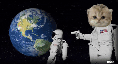 a cat in a space suit points a gun at a man in front of the earth