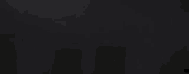a pixel art of a city with a few buildings and a few clouds