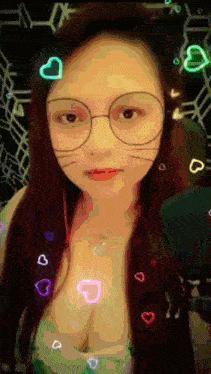 a woman wearing glasses and a cat mask with hearts around her face