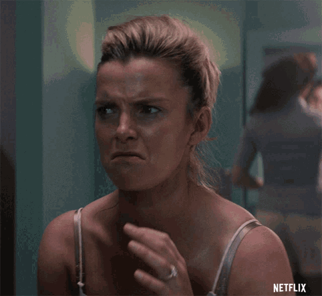 a woman in a white bra says yeah in front of a netflix logo