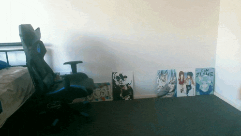 a room with a chair and a painting that says i am slime on it