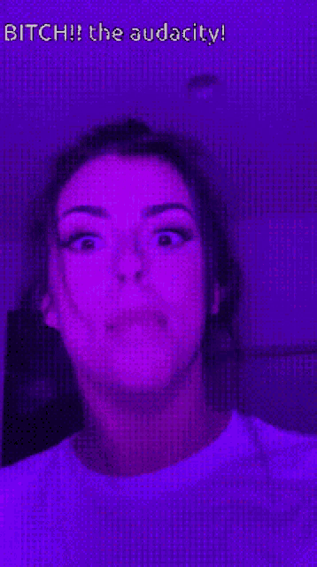 a purple background with a woman 's face and the words " bitch ! the audacity ! "