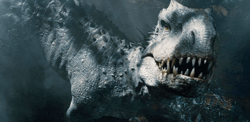a close up of a dinosaur 's face with sharp teeth