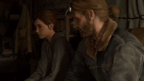 a man and a woman are sitting next to each other in a room in a video game