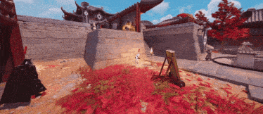 a video game scene with red leaves on the ground and a building in the background