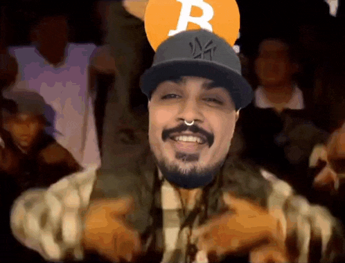 a man with a beard wearing a hat with the letter r on it
