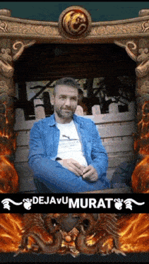 a man in a blue jacket is sitting in front of a dragon statue ..