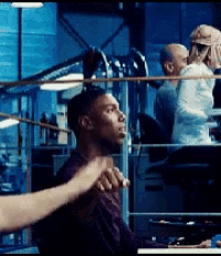 a man in a boxing ring is being punched