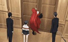 a woman with red hair is standing in a doorway with two men