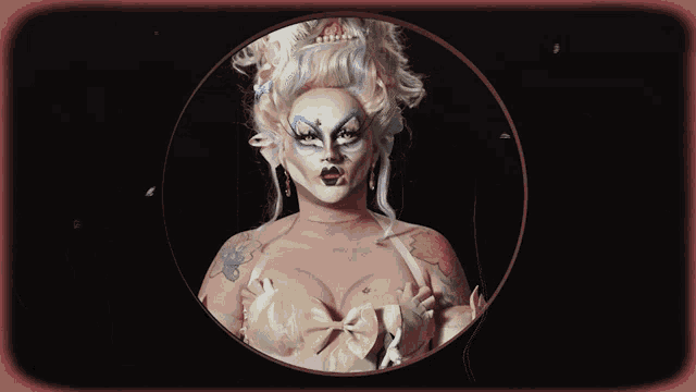 a picture of a drag queen in a circle with a black background