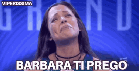 a woman is crying in front of a blue background with the words barbara ti prego on it