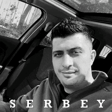 a black and white photo of a man with the name serbey on the bottom