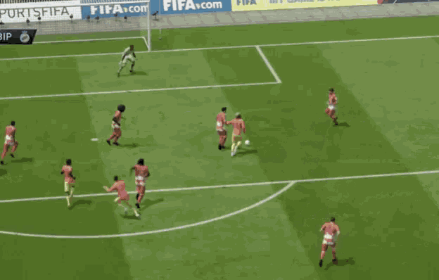 a soccer game is being played on a field with a banner for easports fifa in the background