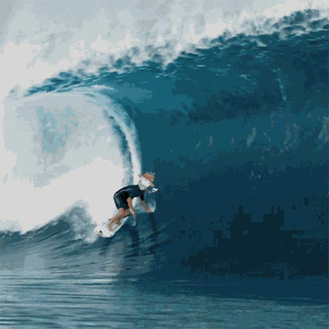 a surfer rides a wave in the ocean