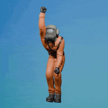 a figurine of a man wearing a gas mask and a helmet