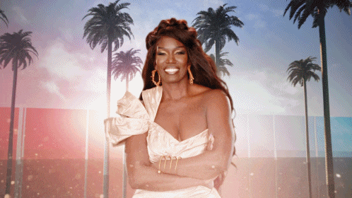 a woman in a white dress is smiling with palm trees in the background