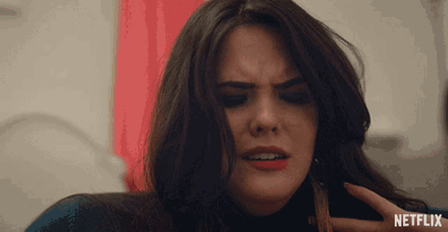a close up of a woman 's face with netflix written on the bottom