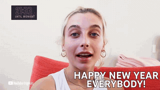 a woman says happy new year everybody in a video