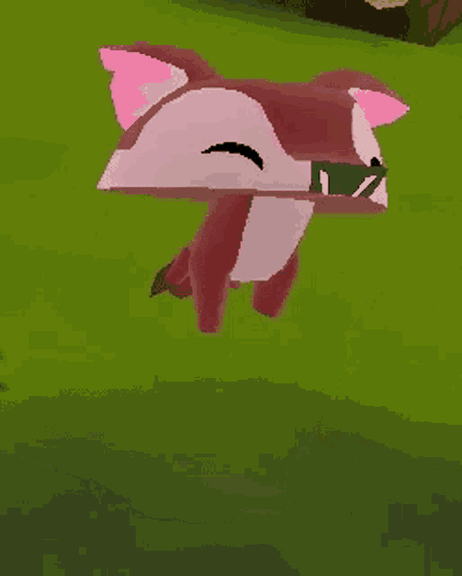 a cartoon fox with pink ears is sitting on a green field .
