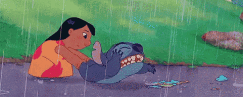 a cartoon character is holding a frog in the rain .