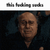 a man is making a funny face with the words `` this fucking sucks '' written above him .