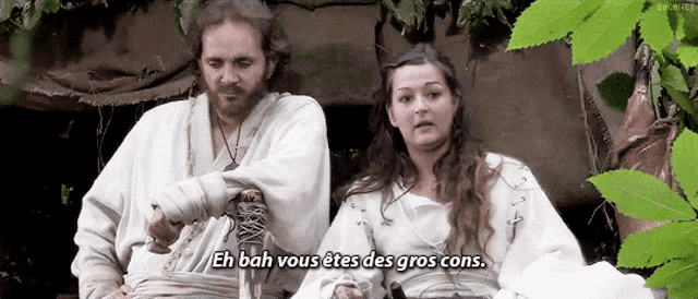 a man and a woman are sitting next to each other and the woman is saying eh bah you 're des gros cons