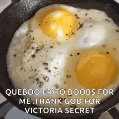 two eggs are cooking in a frying pan with a caption that says queboo frito boobs for me thank god for victoria secret