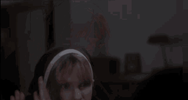a woman in a nun 's outfit is making a hand gesture
