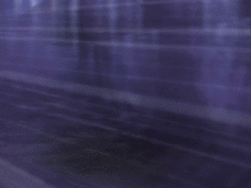 a close up of a person 's arm with a purple snake wrapped around it