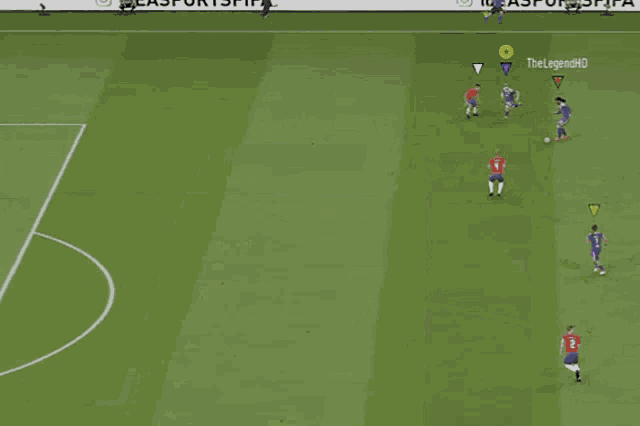 a soccer player kicks the ball in front of a banner that says " follow us on "