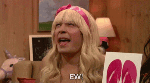 a man dressed as a barbie doll is holding a picture of flip flops .