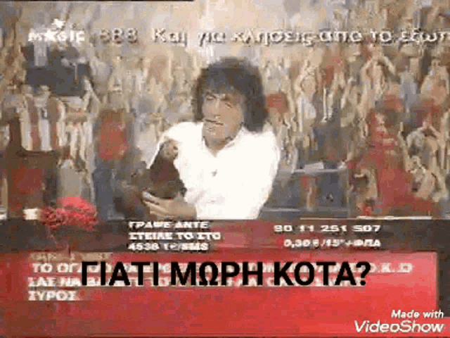 a video showing a man holding a dog with the words made with videoshow in the corner