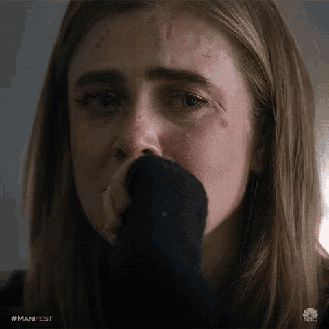 a close up of a woman 's face with a #manifest hashtag