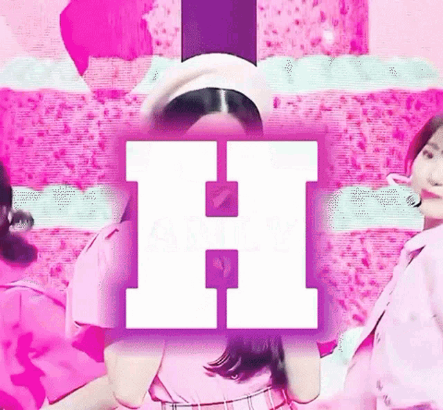 a girl in a pink dress is standing in front of a pink background with a purple letter h .