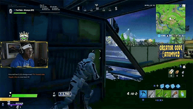 a man playing a video game with a creator code on the screen