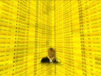 a man and a woman are standing in front of a wall of yellow numbers