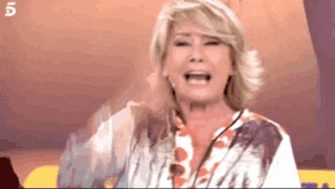 a woman is crying while wearing a floral shirt on a television show .