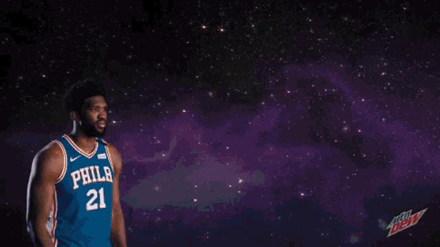 a philadelphia basketball player blows a kiss in front of a basketball that says the more you dunk