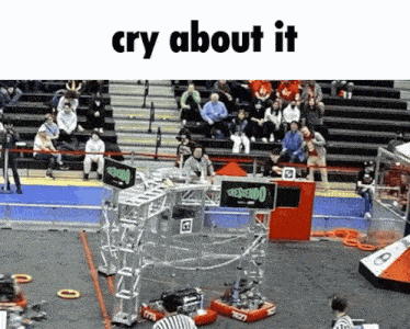 a crowd watching a robotic competition with the words cry about it on the bottom