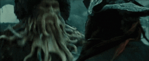a giant octopus is eating a man 's face in a movie scene .