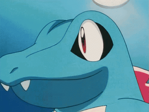 a close up of a cartoon character with its mouth open and teeth showing .
