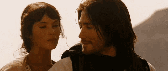 a man and a woman are standing next to each other
