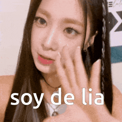 a close up of a woman 's face with the words soy de lia written on the bottom